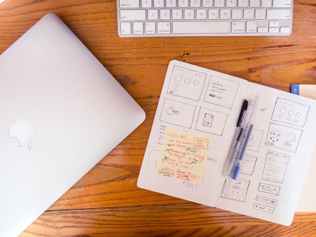 Laptop and UI wireframe sketches — web and app design