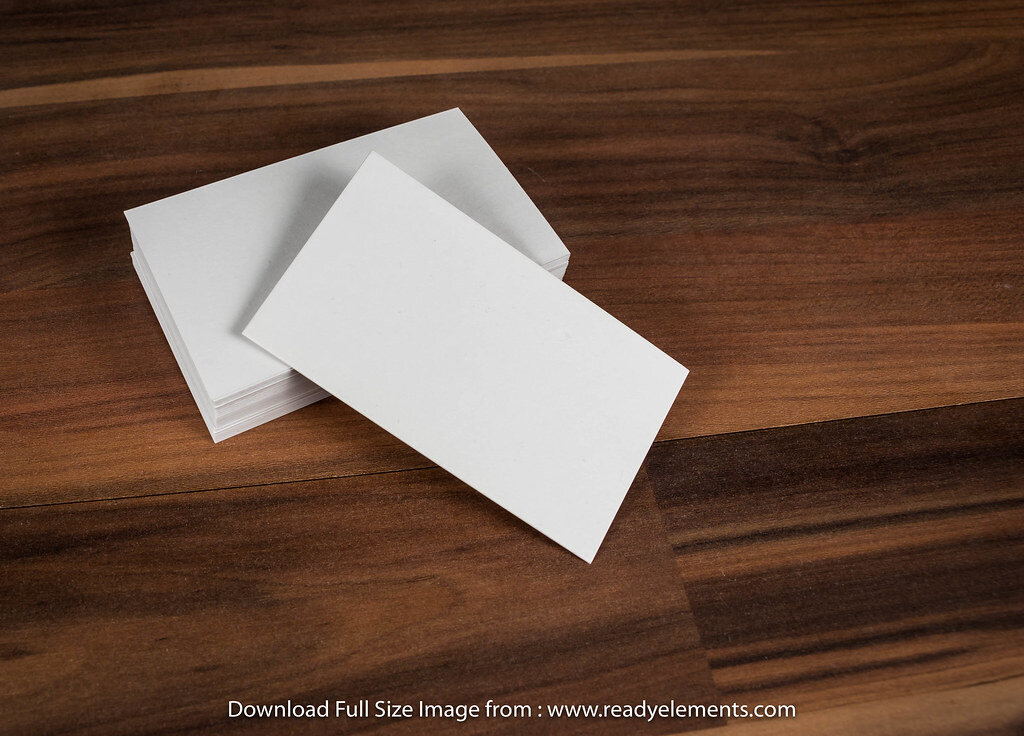 Clean business cards on a desk — brand and print design